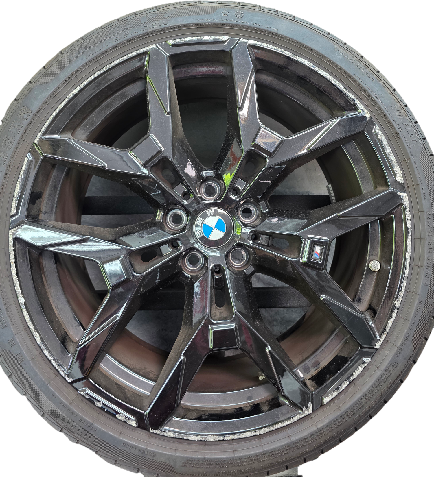Wheel before repair — damaged with curb rash